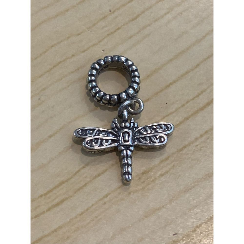 .925 Dragonfly dangling from Ornate Ring #garden